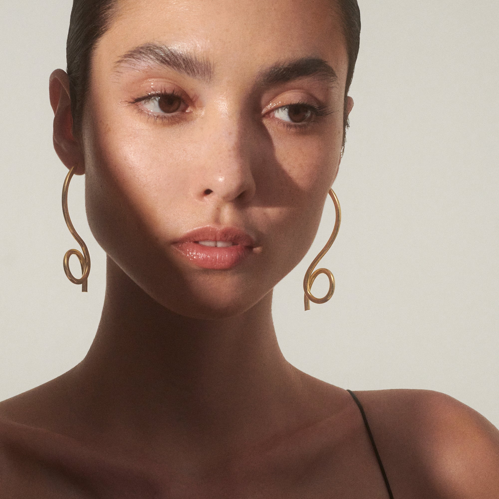 Cursive Earrings in Gold