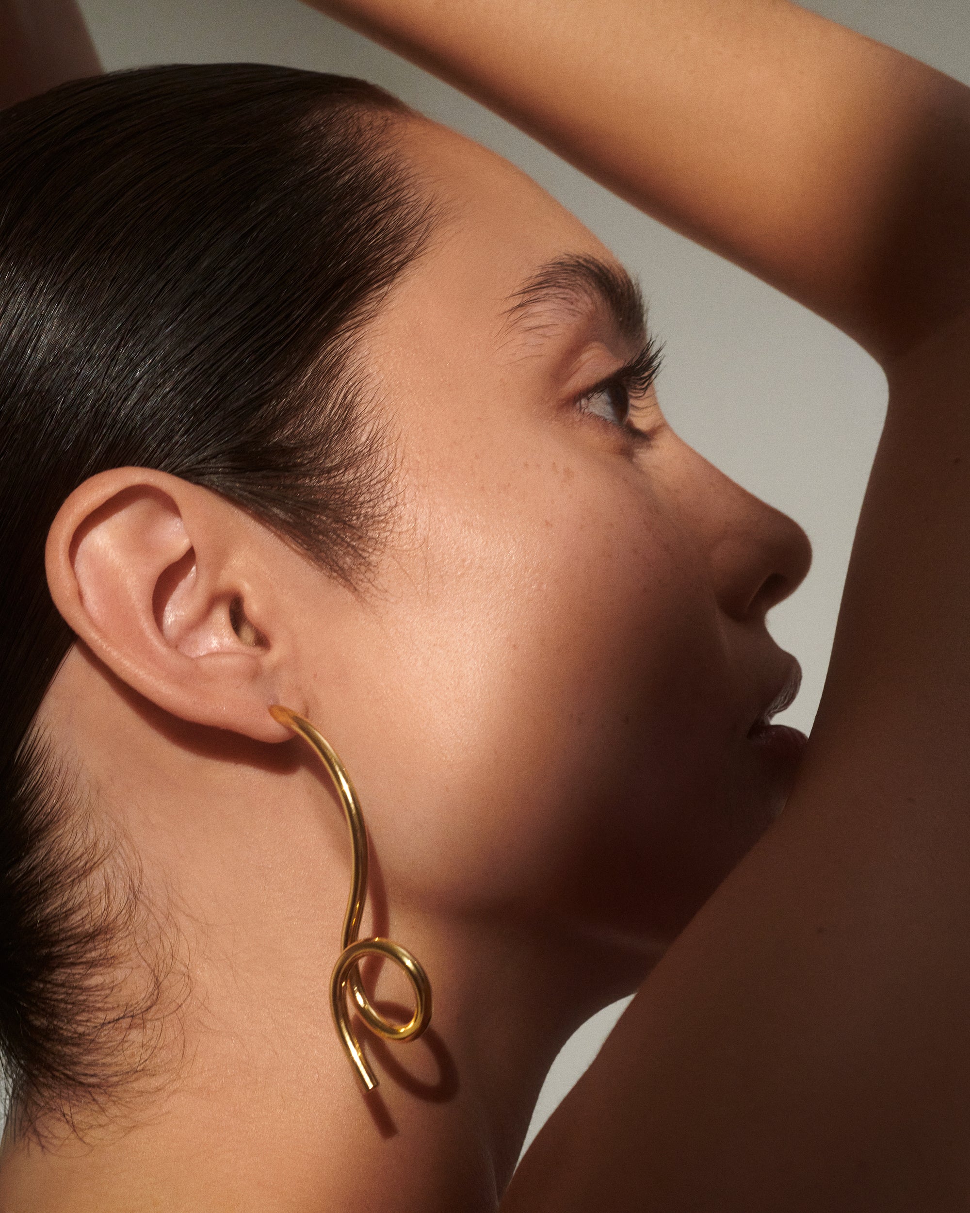 Cursive Earrings in Gold